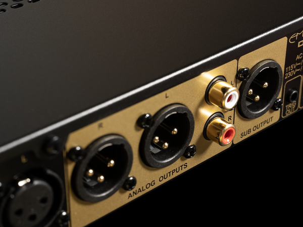 Close-up of audio equipment with various connectors on a black background