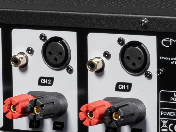 Close-up of audio equipment with XLR and RCA connectors on a black background