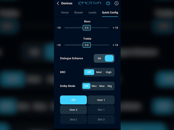 A smartphone app settings screen for EMOTIVA devices, showing audio configuration options such as Bass, Treble, Dialogue Enhance, DRC, and Dolby Mode with sliders and toggle switches on a dark background.