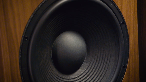 Close-up of a black driver on a wooden background