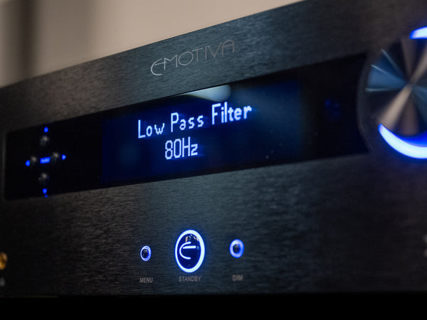 Audio equipment with digital display showing 'Low Pass Filter 80Hz' and brand name.