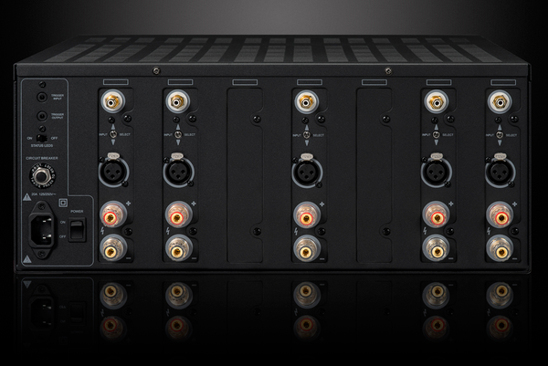 Photo of the rear view of the XPA Gen3 5 Channel Amplifier on a dramatic gray background showing off the inputs and outputs